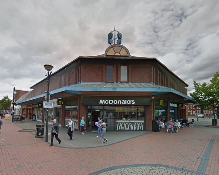 McDonald's storefront with pedestrians outside, related to new details after video of 13-year-old arrested sparks outrage.