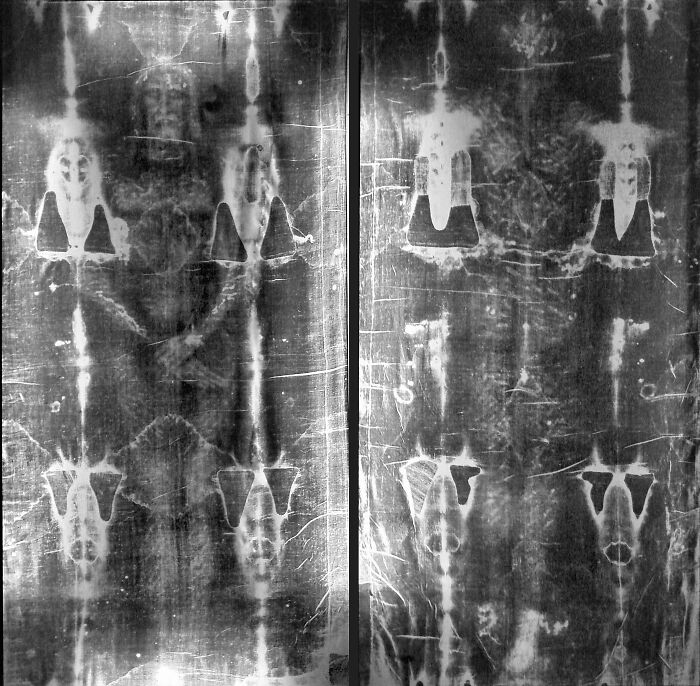 Black and white image of the Shroud of Turin showing faint human-like figure possibly draped on a statue, not a body. Black and white image of the Shroud of Turin showing faint human-like figure possibly draped on a statue, not a body.