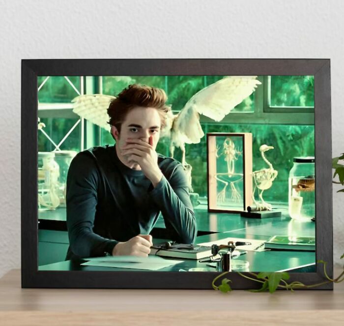 Person sitting at a desk surrounded by decor pieces that create a magical home atmosphere with unique bird sculptures and framed art.