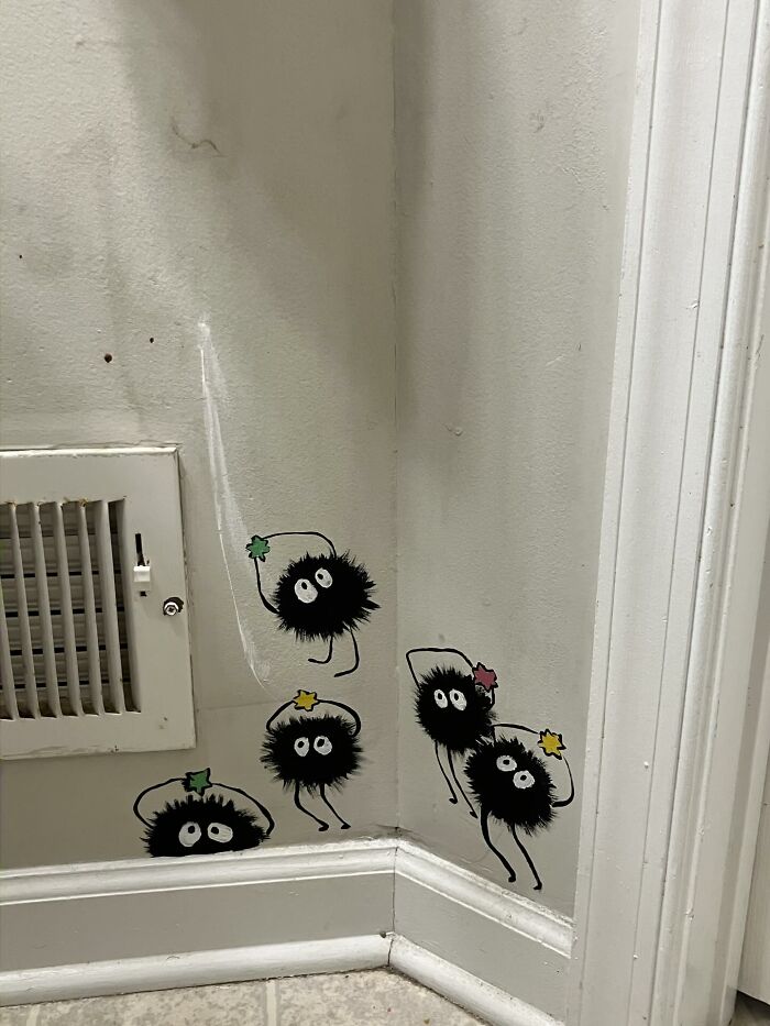 Black fuzzy decor pieces with eyes and colorful stars, placed in a home corner adding magical home decoration charm.