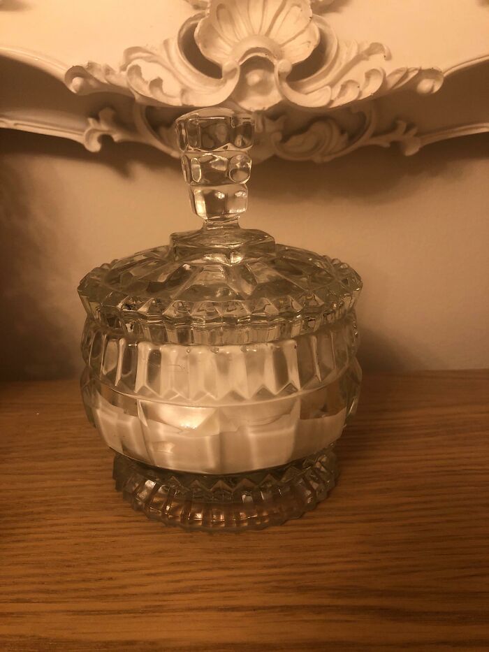Cut glass decorative jar with intricate details, adding a magical decor piece to a cozy home setting.