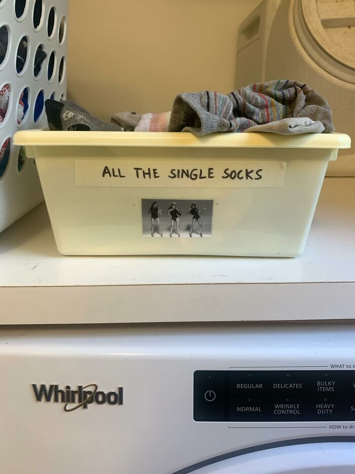 Laundry basket labeled for single socks, a practical decor piece that made homes a more magical place with organization charm.