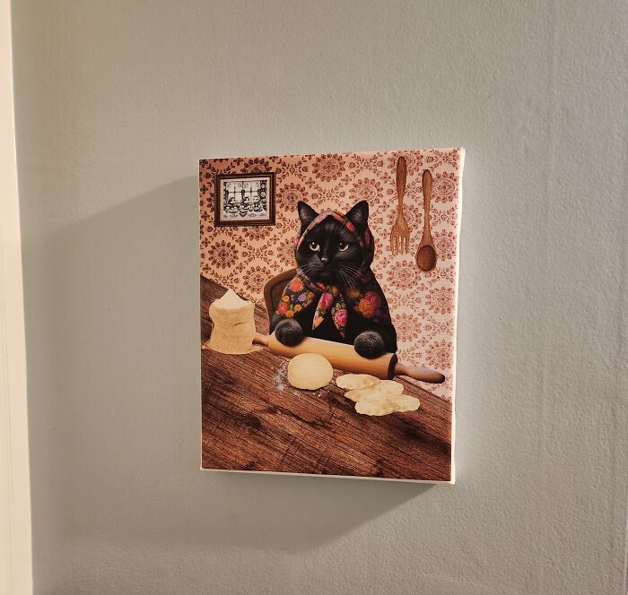 Decor piece artwork of a black cat baking with a rolling pin, adding a magical touch to home decor.