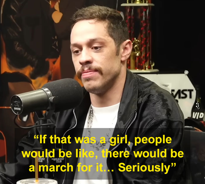 Pete Davidson speaking into microphone, addressing scrutiny and double standard about size of his manhood during interview.