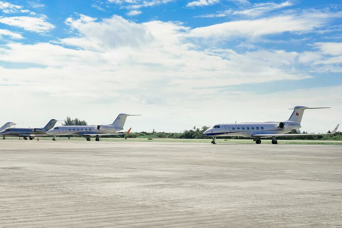 Three private jets parked on a runway under a blue sky, illustrating the concept of picking the wrong line.