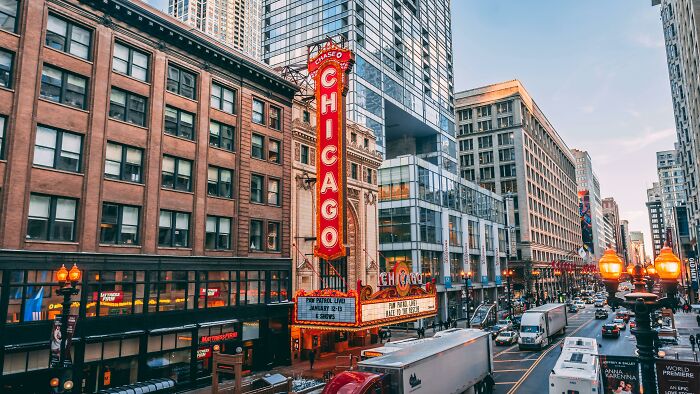 Busy Chicago street with theater marquee and traffic, illustrating totally safe things that people can’t stop freaking out about.