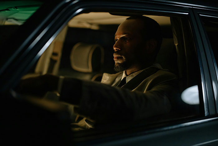 Man sitting in a car at night, appearing deep in thought about a friend, wife, and drunk hookup with another man. Man sitting in a car at night, appearing deep in thought about a friend, wife, and drunk hookup with another man.