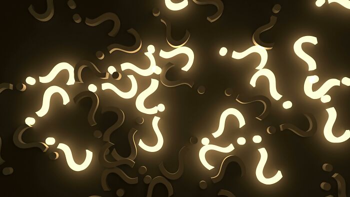 Glowing question marks floating in dark space representing logic puzzles that challenge and test your brain skills.