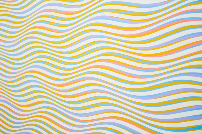 Wavy colorful lines creating an optical illusion pattern challenging viewers to see beyond the obvious man figure. Wavy colorful lines creating an optical illusion pattern challenging viewers to see beyond the obvious man figure.