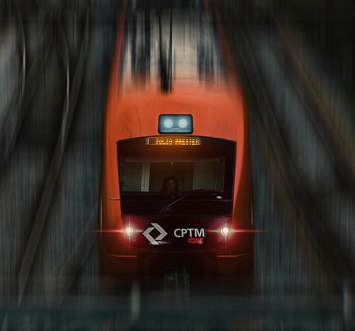 Front view of a red train surrounded by blurred tracks, symbolizing the feeling of picking the wrong line at the grocery store.