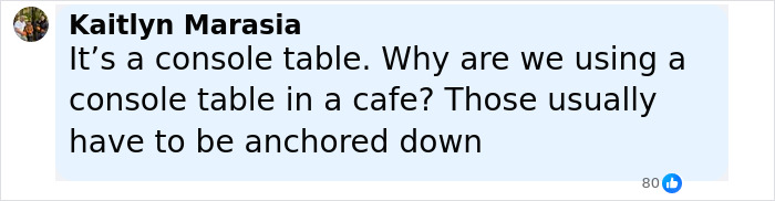 Screenshot of a social media comment questioning the use of a console table in a caf&eacute; after a $1,600 table incident.