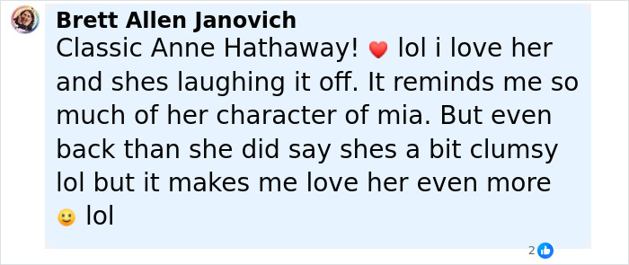 Comment discussing Anne Hathaway laughing off a clumsy moment, referencing her character Mia and her charm.