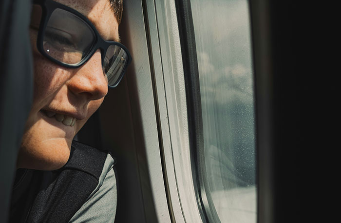Pilot looking out airplane window, reflecting on terrifying situation experienced during flight in cockpit environment.