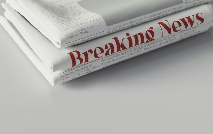 Stack of newspapers with Breaking News headline symbolizing ingenious inventions that found new purposes over the years.