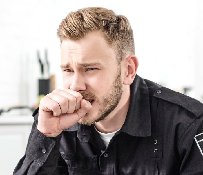 Police officer looking disturbed and worried, reacting to creepy and disturbing things seen at a home.