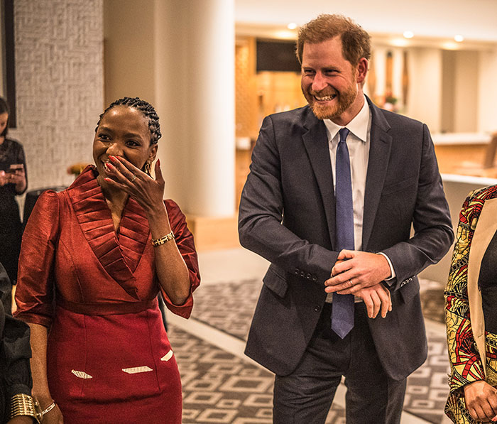 Prince Harry smiling and talking with attendees at an event following Sentebale scandal investigation findings. - 6