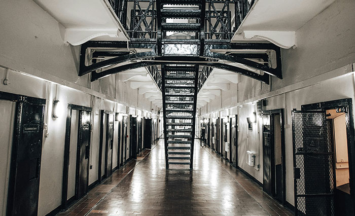 Prison corridor with cells and staircases, symbolizing a prison officer&rsquo;s perspective on Epstein&rsquo;s death controversy.