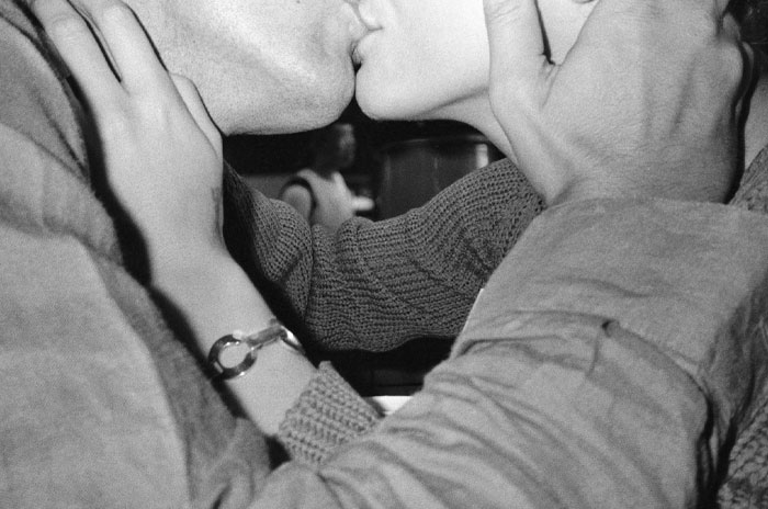 Couple sharing an intimate kiss, capturing a romantic mood perfect for mood-based questions with your crush.