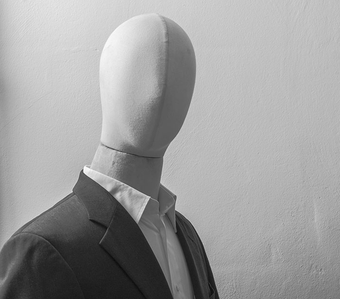 Faceless mannequin dressed in a suit, symbolizing rage room customers who need therapy instead of stress relief.