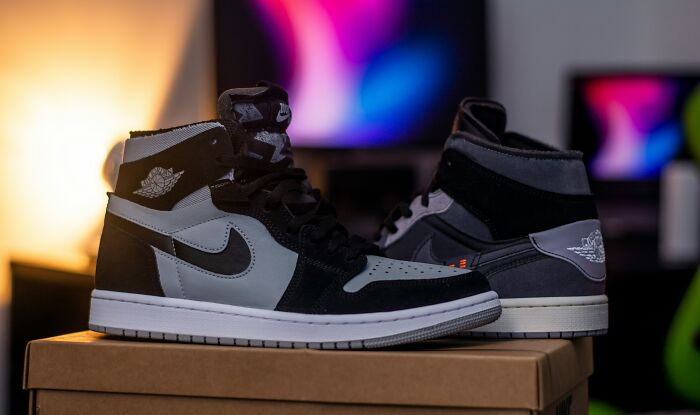 Pair of black and gray Nike sneakers displayed on a box, highlighting unique money-making hacks with collectible shoes.