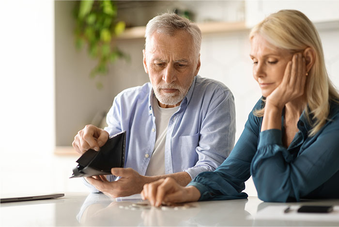 Elderly parents looking worried while counting coins, expecting financial support from daughter after losing savings. Elderly parents looking worried while counting coins, expecting financial support from daughter after losing savings.