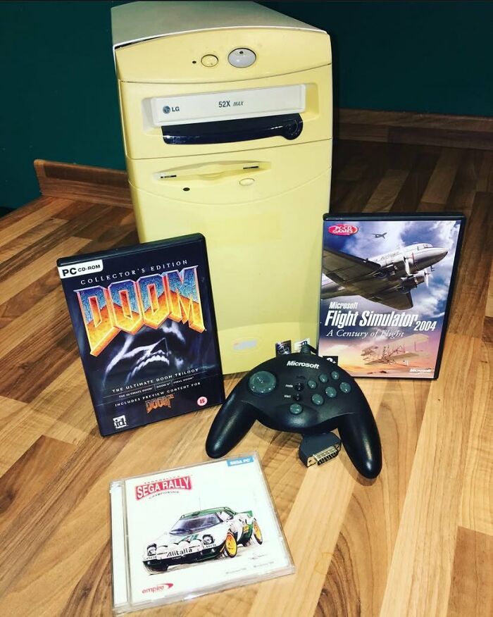 Beige retro gaming PC tower with classic game cases and a Microsoft controller, evoking nostalgia for ’80s and ’90s gamers.