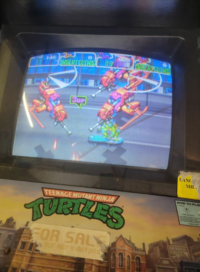 Arcade machine screen showing retro gaming action from Teenage Mutant Ninja Turtles, capturing nostalgia from the ’80s and ’90s.