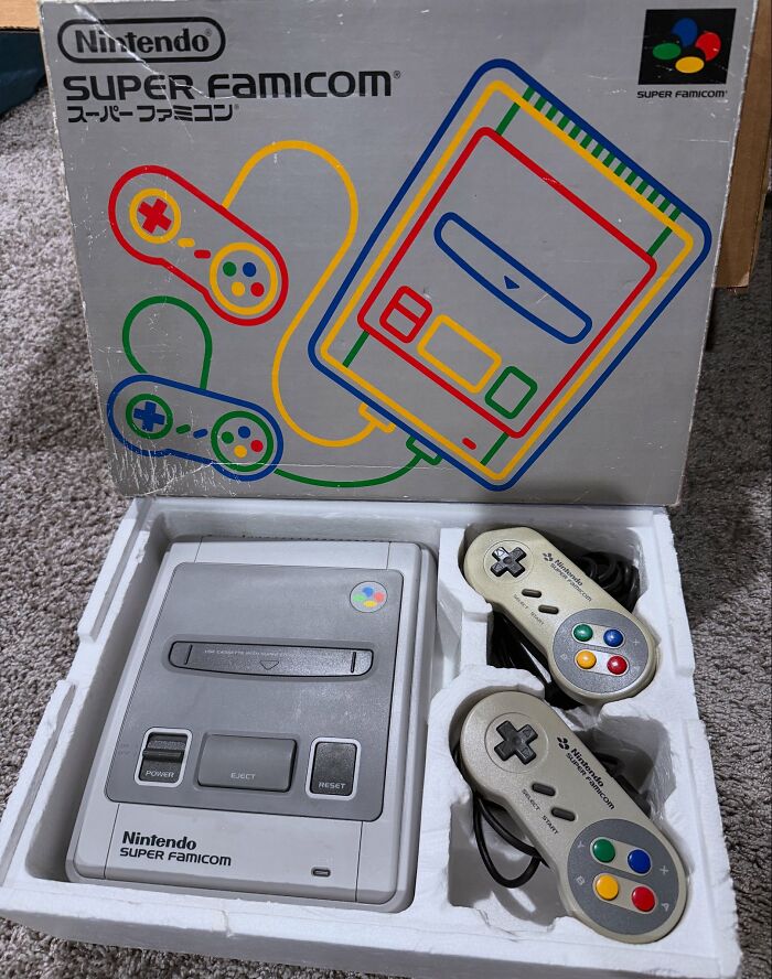 Nintendo Super Famicom console and controllers in original packaging, showcasing retro gaming and nostalgia from the ’90s and ’00s.