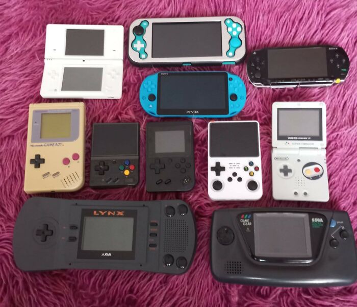 A collection of retro gaming handheld consoles from the 80s, 90s, and 00s showing nostalgia and vintage gaming devices.