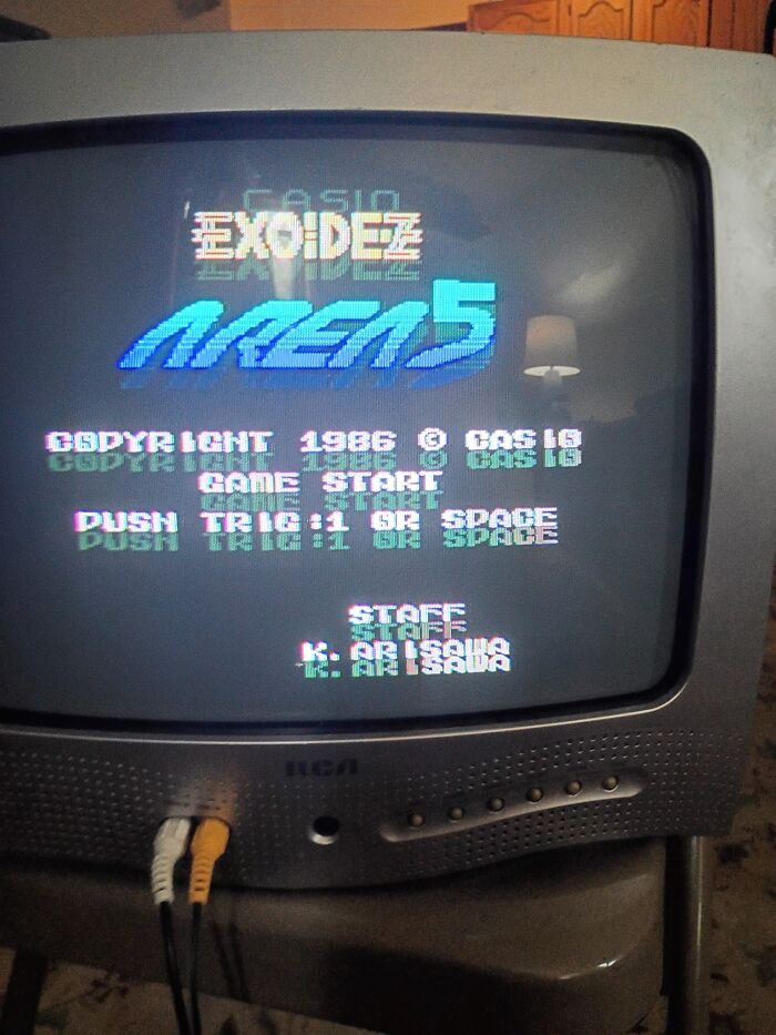 Old CRT television displaying a retro gaming screen from the 1980s, evoking nostalgia for classic arcade games.