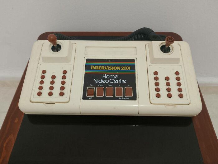 Vintage InterVision 2001 retro gaming console with joysticks and buttons, evoking 80s and 90s nostalgia.