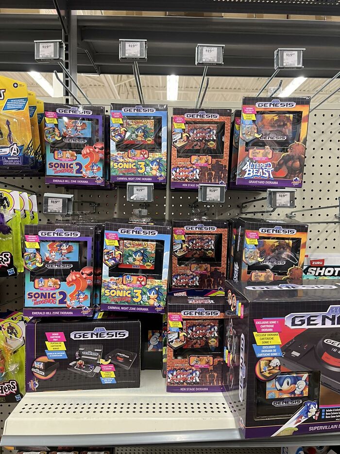 Sega Genesis retro gaming collectibles featuring Sonic the Hedgehog and classic game dioramas on store shelves.