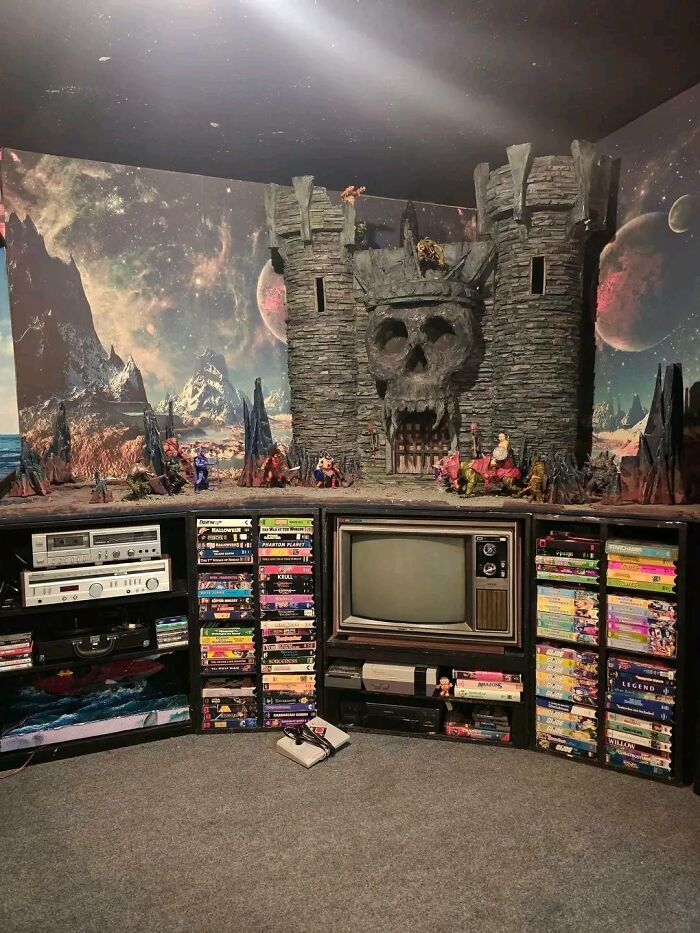 Retro gaming setup with vintage TV, classic video games, VHS tapes, and a fantasy castle backdrop for nostalgia fans.