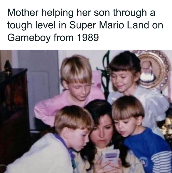 Mother helping her son beat a tough level in Super Mario Land on Gameboy, a classic moment of retro gaming nostalgia.