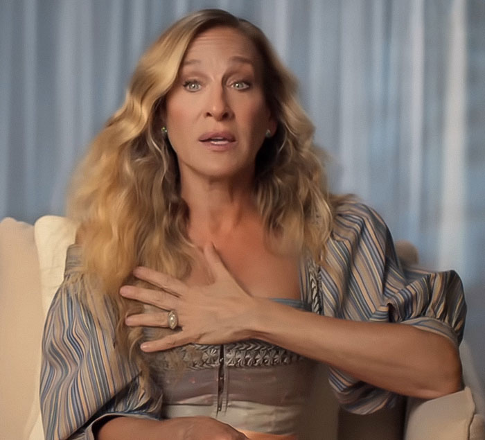 Sarah Jessica Parker speaking passionately while addressing And Just Like That series finale critics in a casual indoor setting. Sarah Jessica Parker speaking passionately while addressing And Just Like That series finale critics in a casual indoor setting.