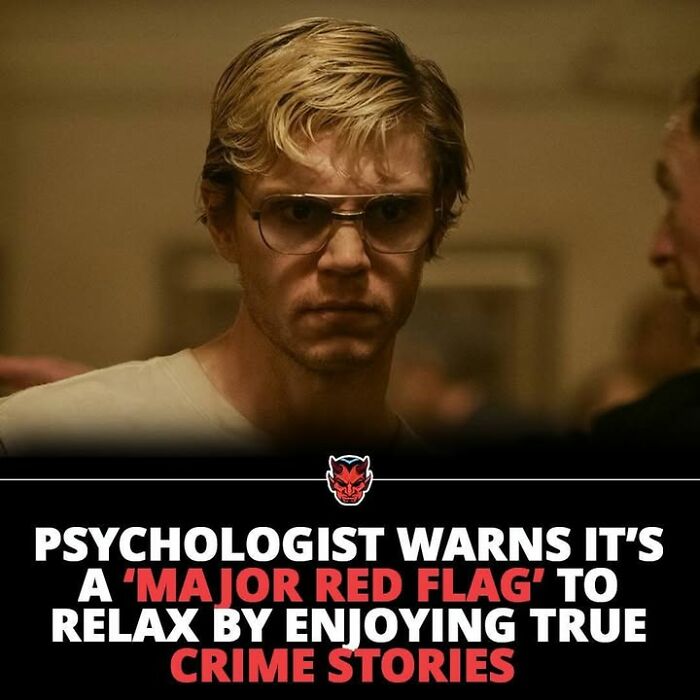 Young man with glasses looking serious in a dim room, illustrating creepy facts and true crime stories theme.