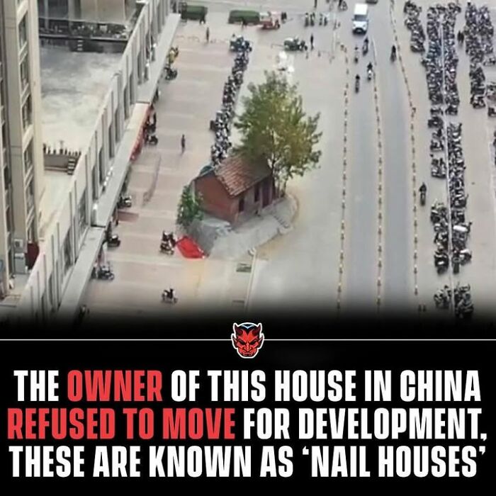 A creepy nail house standing alone amid urban development, illustrating a random creepy fact about refusal to move buildings.