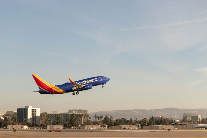 Southwest Airlines airplane taking off, illustrating airline controversy over new rule affecting plus-size passengers. Southwest Airlines airplane taking off, illustrating airline controversy over new rule affecting plus-size passengers.