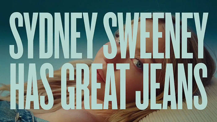 Sydney Sweeney on red carpet wearing jeans, highlighting genes with bad taste controversy in fashion comments.