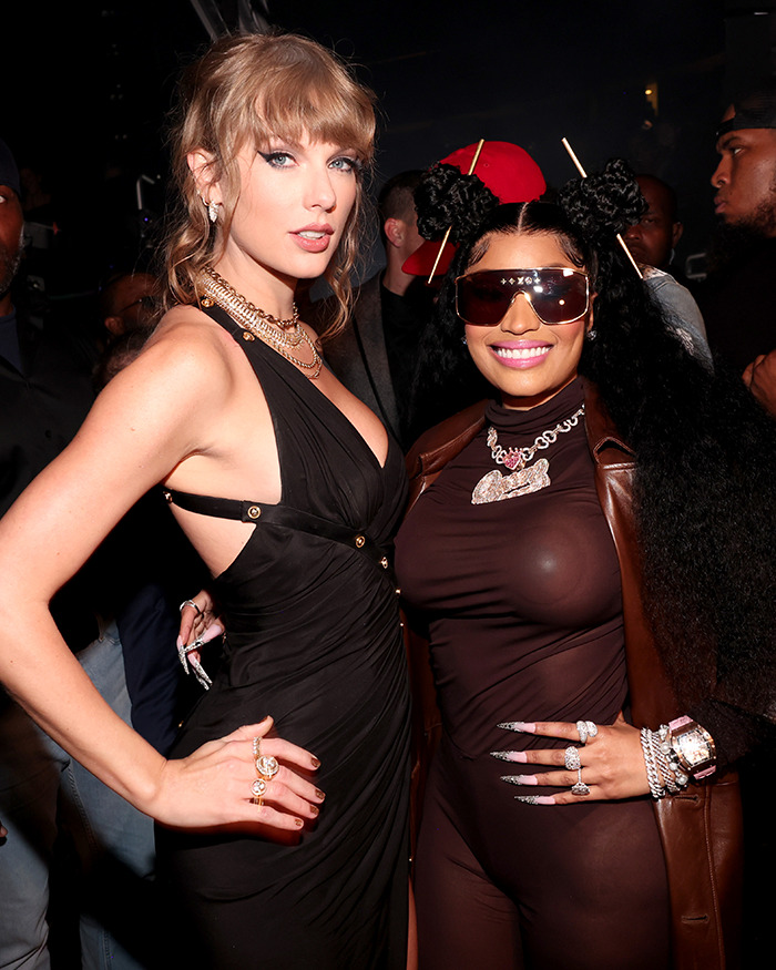 Two celebs posing together at an event, showcasing fashion and style in a social media moment with fellow A-listers.