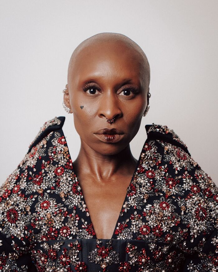 Cynthia Erivo with bold makeup and piercings, wearing an ornate beaded outfit, linked to mass outrage and demon keyword. Cynthia Erivo with bold makeup and piercings, wearing an ornate beaded outfit, linked to mass outrage and demon keyword.