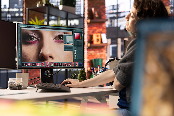 Person editing a close-up photo on computer screen, exploring hot takes related to boomers' opinions.