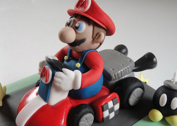 Mario character figurine driving a red go-kart, themed around things that weren’t mentioned until after marriage.