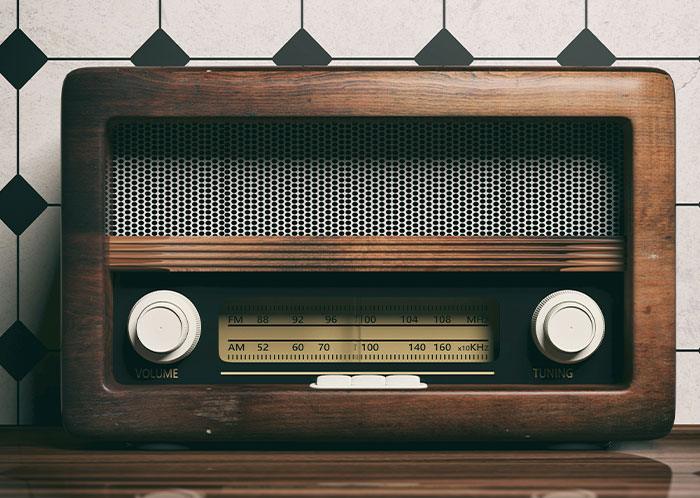 Vintage wooden radio on table with retro design reflecting things not mentioned until after marriage topics.