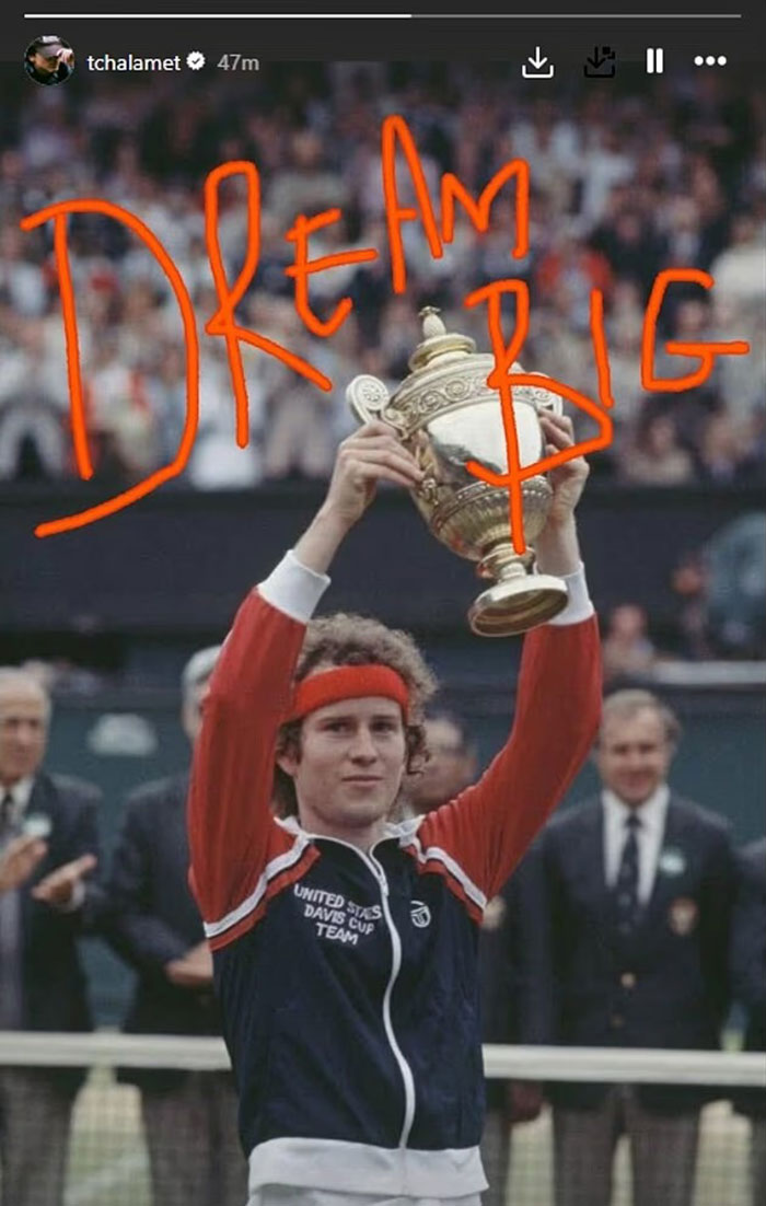 Timoth&eacute;e Chalamet holding a tennis trophy with Dream Big text, linked to Kylie Jenner racy posts trending news.