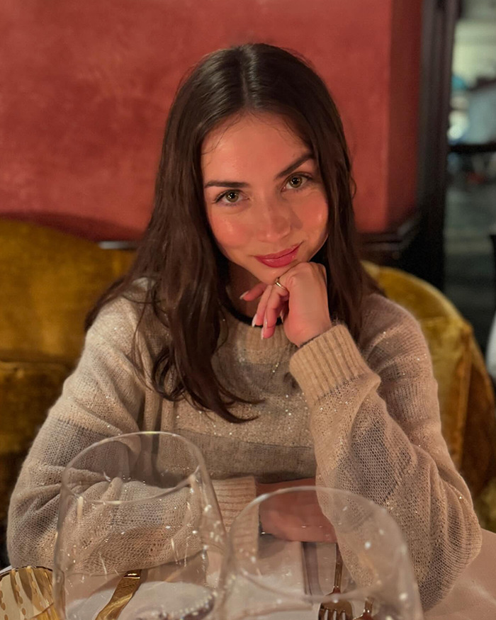 Young woman with long brown hair wearing a beige sweater sitting at a table with wine glasses, related to Tom Cruise candid photo SEO topic. Young woman with long brown hair wearing a beige sweater sitting at a table with wine glasses, related to Tom Cruise candid photo SEO topic.