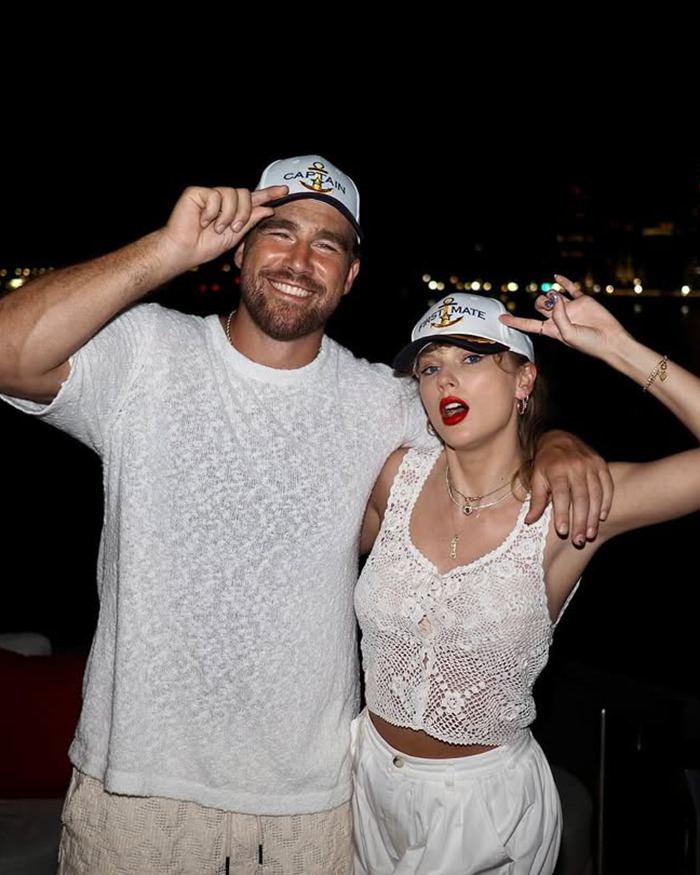 Travis Kelce&rsquo;s ex and Taylor Swift posing together at night wearing matching captain and mate hats.