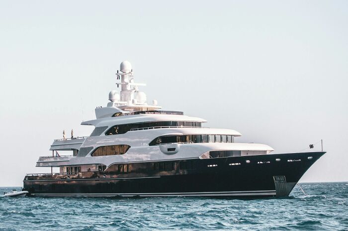 Luxury yacht on the ocean illustrating wealth gap and highlighting stories that make you feel poorer than you are.