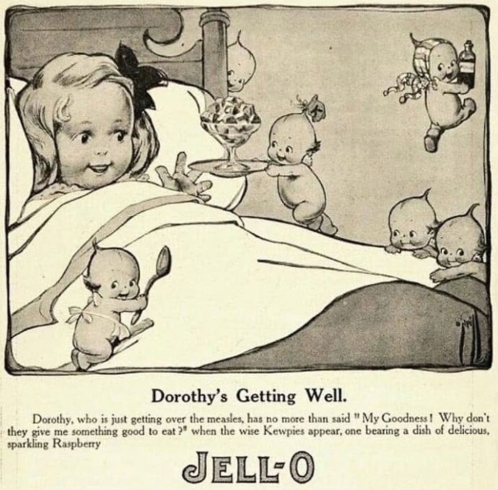 Vintage closet illustration of a girl in bed served by small Kewpie dolls with a dish of Jell-O dessert.