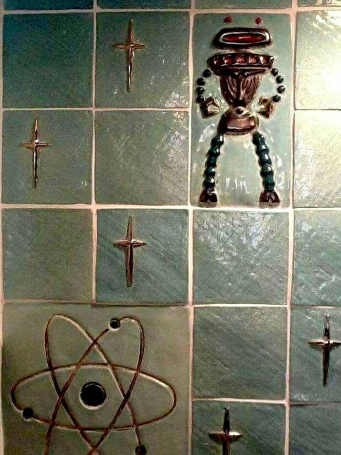 Vintage closet style tiles featuring old-timey atomic and star designs in muted green tones.